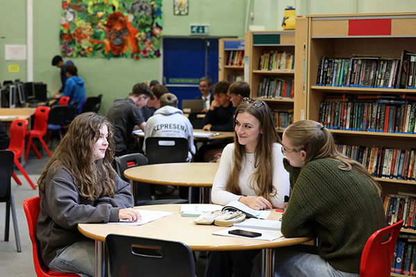 Group of students in libraru