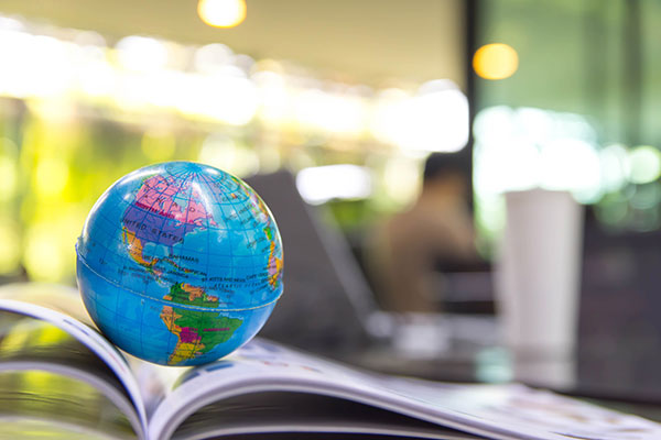 Globe on geography textbook