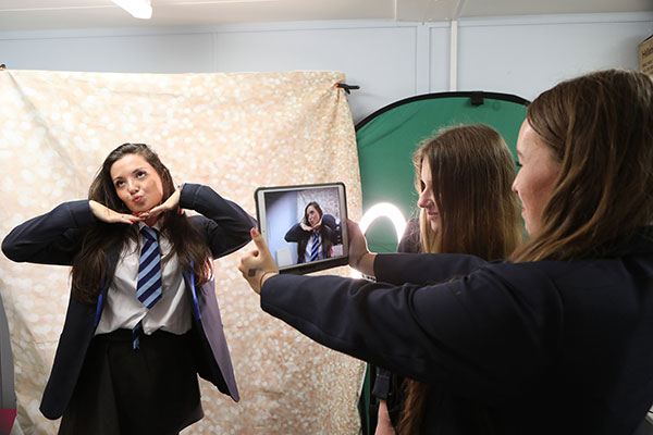 High school girls using iPad