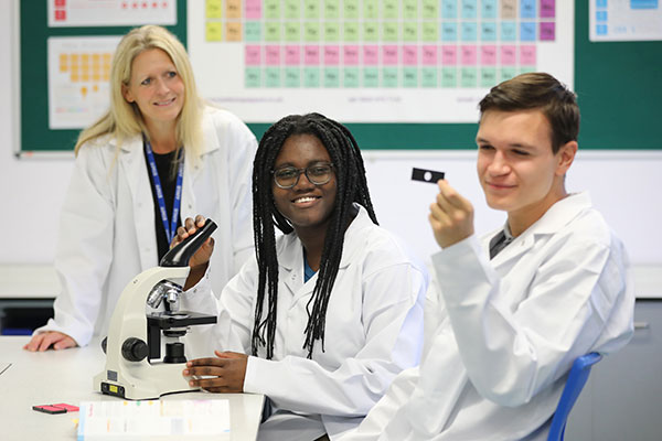 Students looking at microscope slides