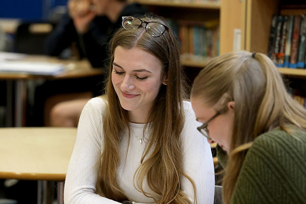 Female sixth form students in library